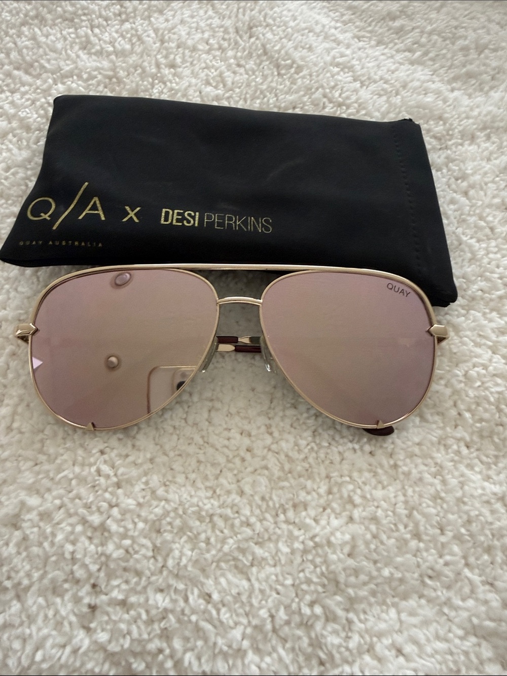 Quay Australia High Key Silver Frame Sunglasses with Light Pink Lenses.